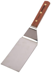 Dexter hamburger turner front view showing stiff blade and offset for precise flipping