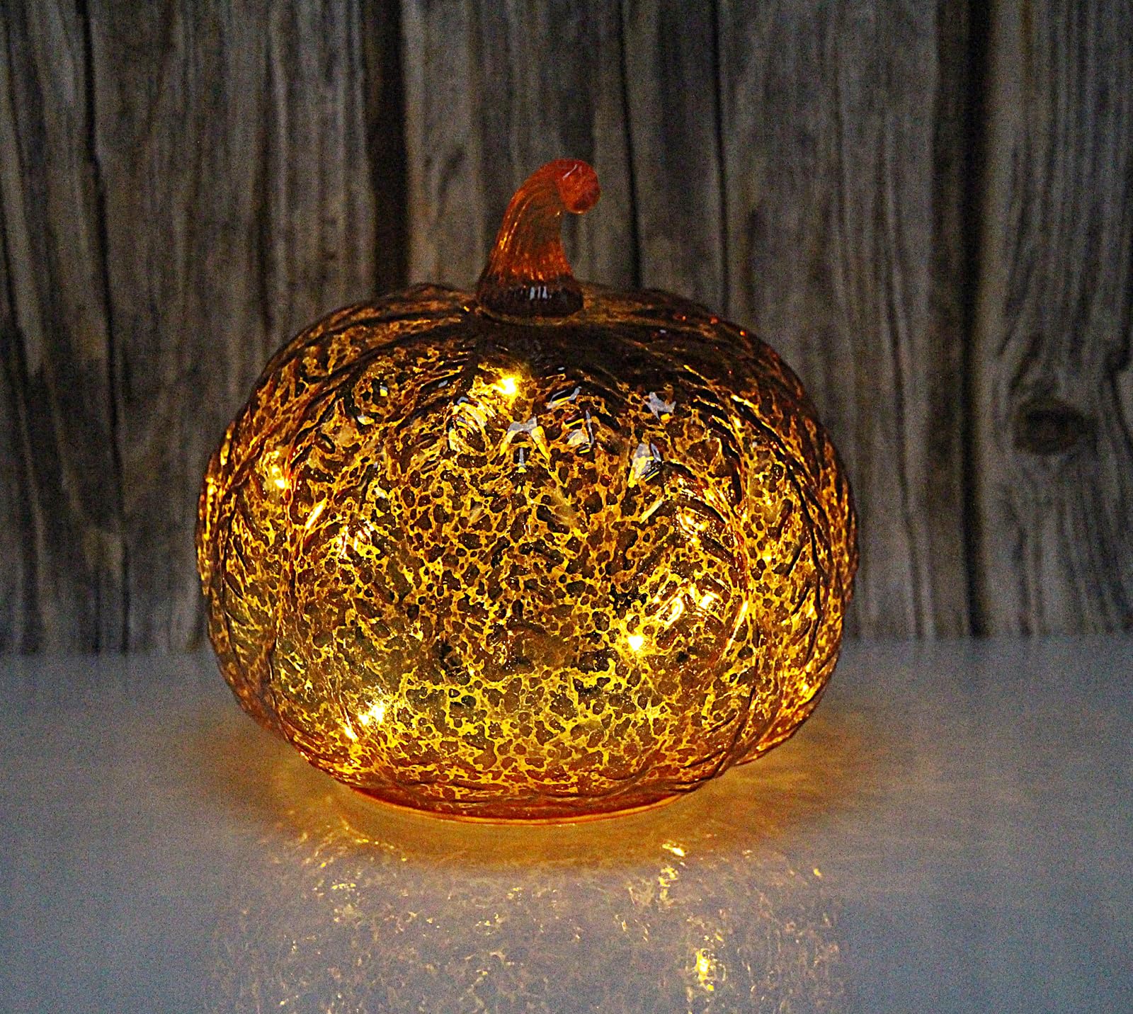 Deyivela pumpkin next to hand showing compact portable size