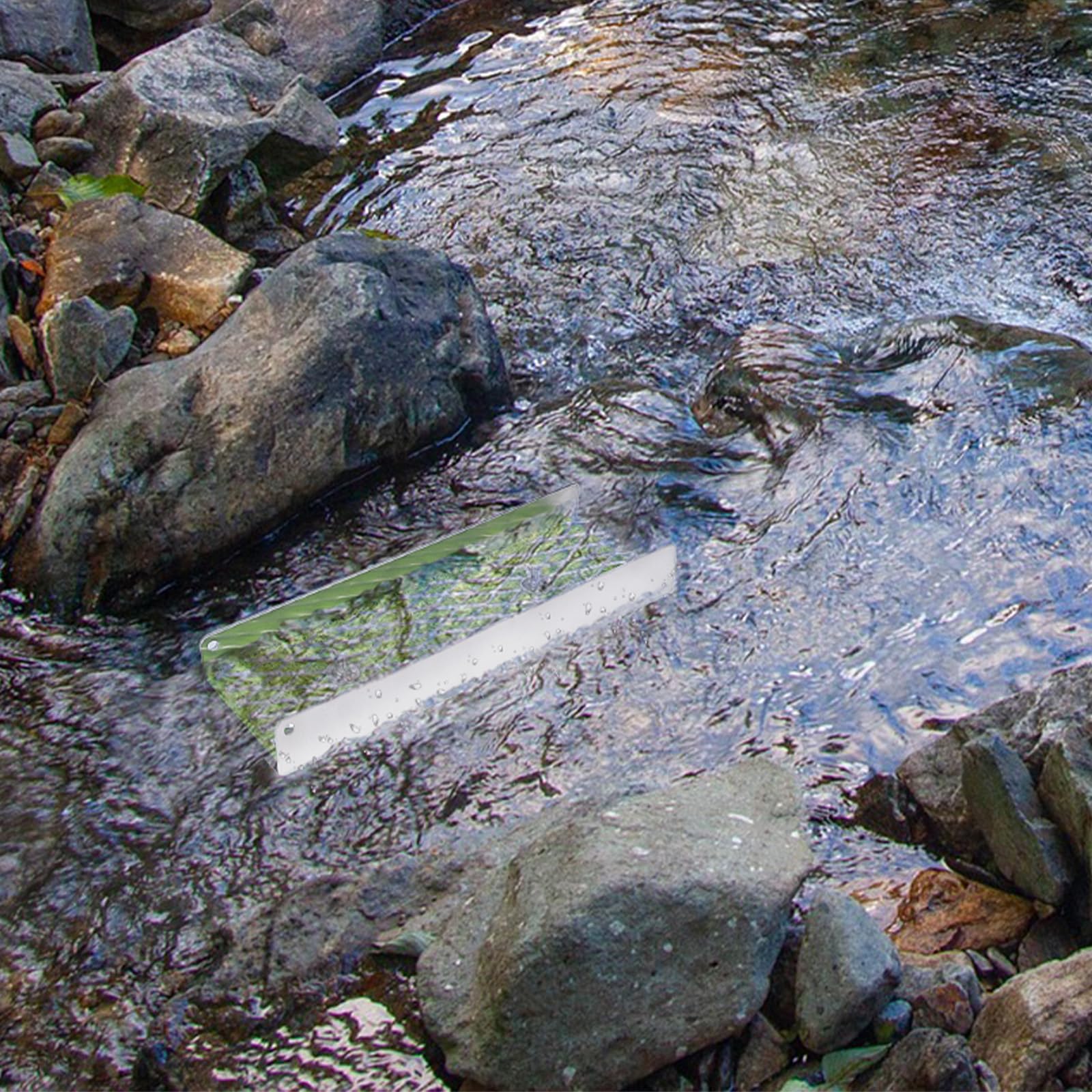 DigNew mini sluice installed in a shallow stream showing real-world prospecting setup