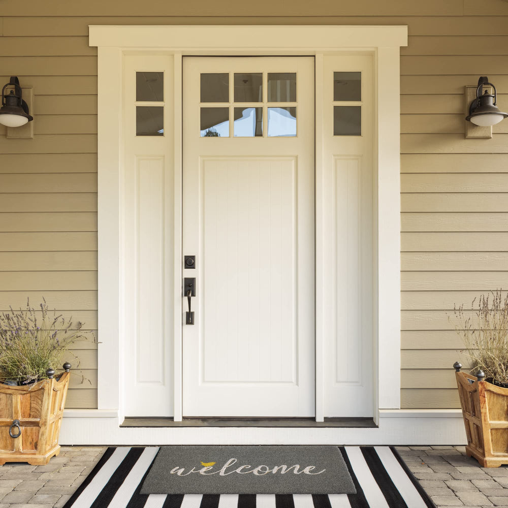 DII doormat placed at doorstep demonstrating real-world dirt-trapping benefit