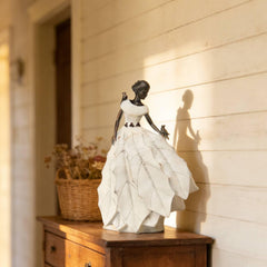 DiliComing statue on patio table adding charm and visual interest