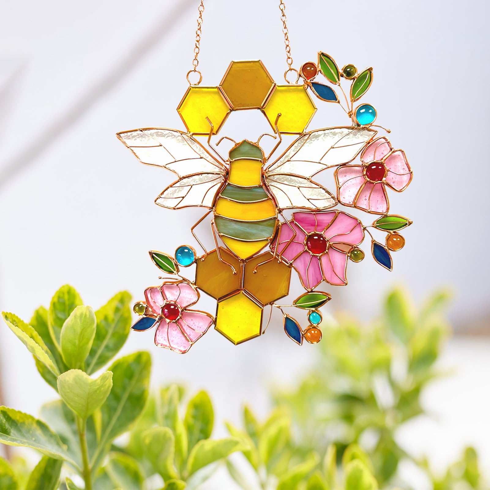DiuDiuLYU suncatcher hanging in sunlit window casting colorful reflections benefits brightens room