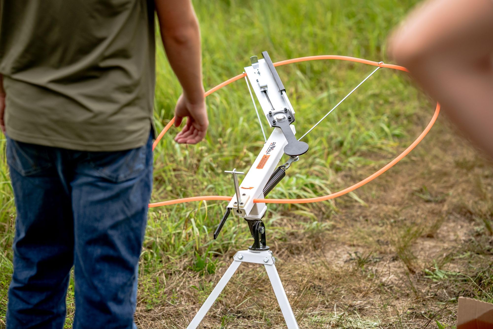Do All Outdoors trap launching a clay in mid-air for realistic practice benefit