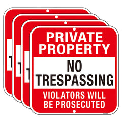 Doninex front view of four reflective no trespassing signs showing bold lettering and durability