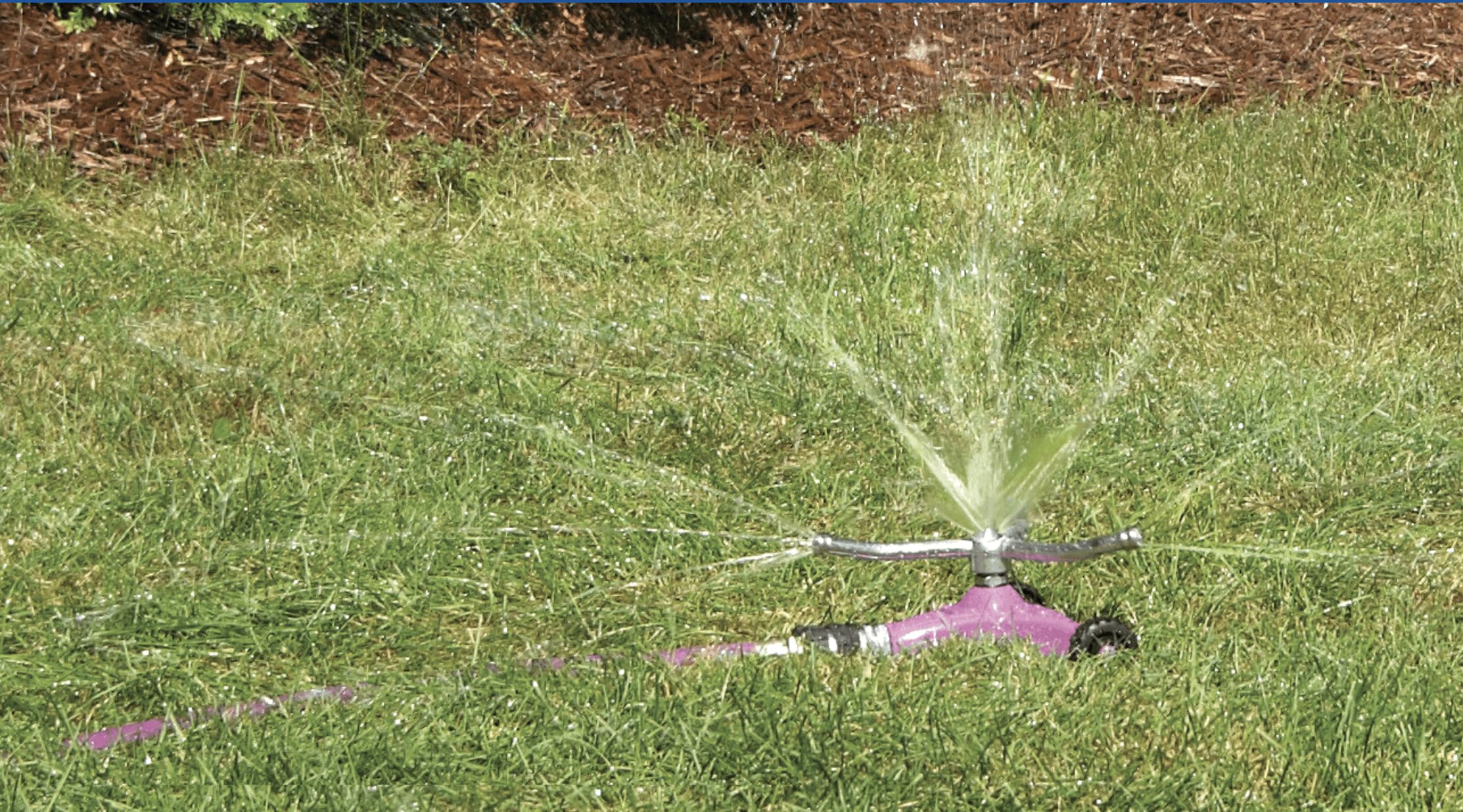 Dramm ColorStorm close-up of three-arm metal sprinkler head for consistent water distribution
