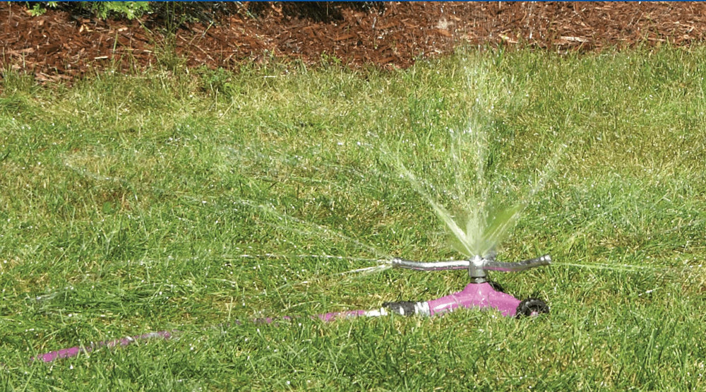 Dramm ColorStorm close-up of three-arm metal sprinkler head for consistent water distribution