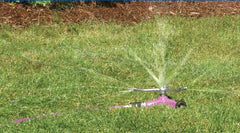 Dramm ColorStorm close-up of three-arm metal sprinkler head for consistent water distribution