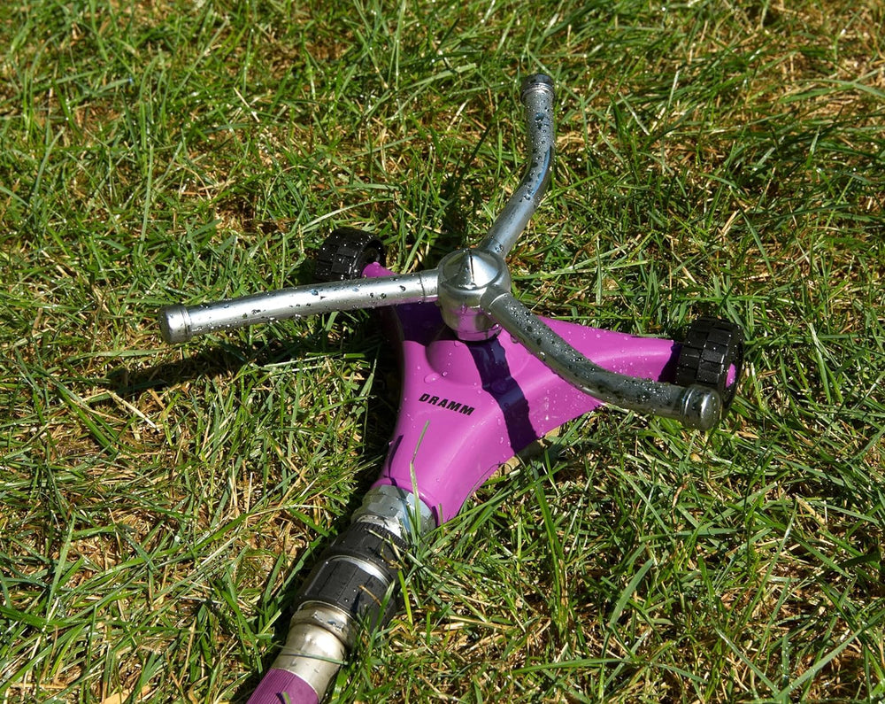 Dramm ColorStorm operating on a lawn demonstrating wide coverage and uniform watering