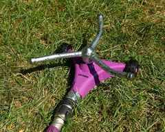 Dramm ColorStorm operating on a lawn demonstrating wide coverage and uniform watering