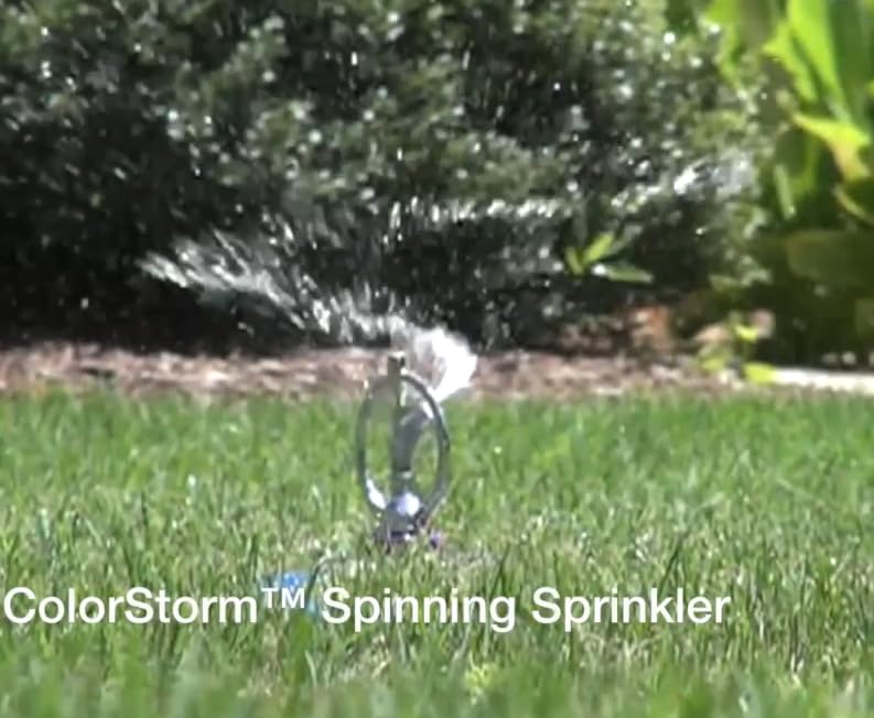 Dramm ColorStorm red installed in flowerbed, gives gentle even watering benefit