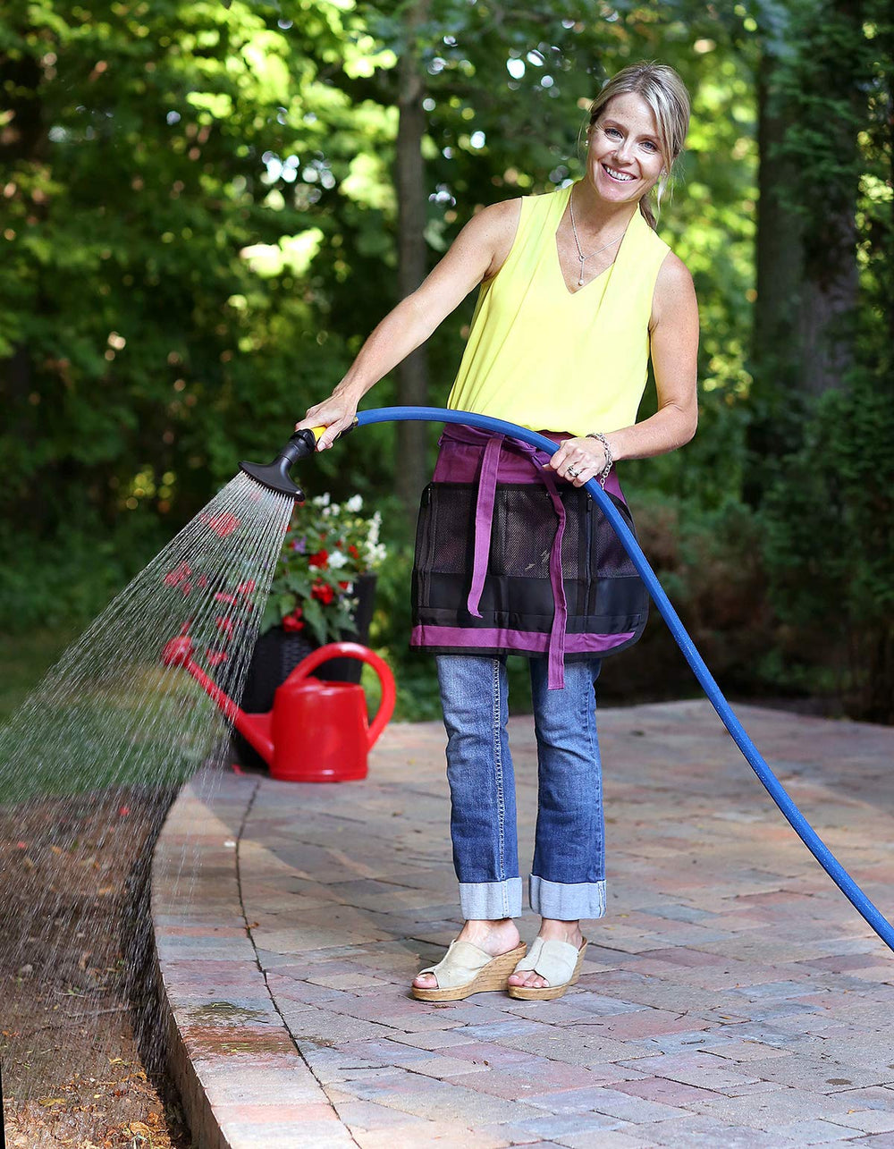 Dramm close-up of thumb-control slider for effortless one-handed watering