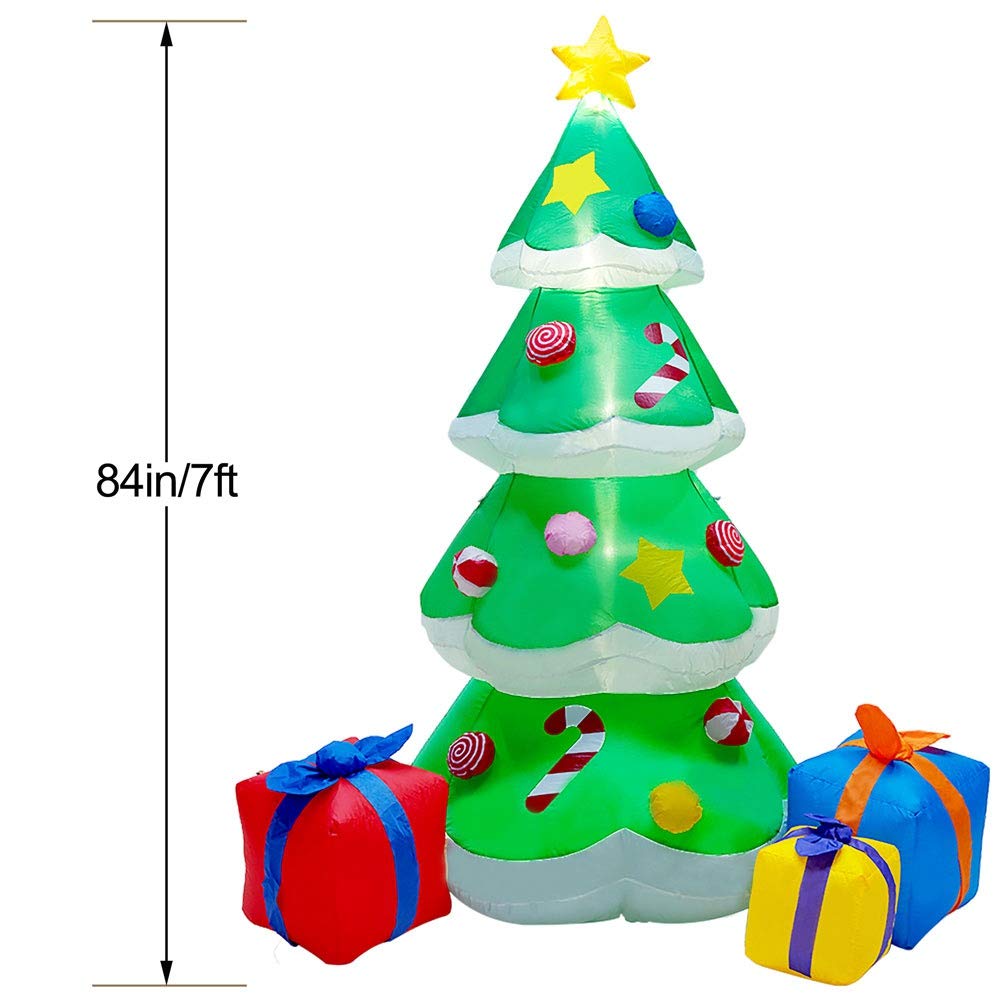 DR.DUDU gift boxes at tree base showing printed detail and decorative charm
