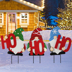 DR.DUDU gnome trio front view showing whimsical red HOHOHO letters and festive benefit
