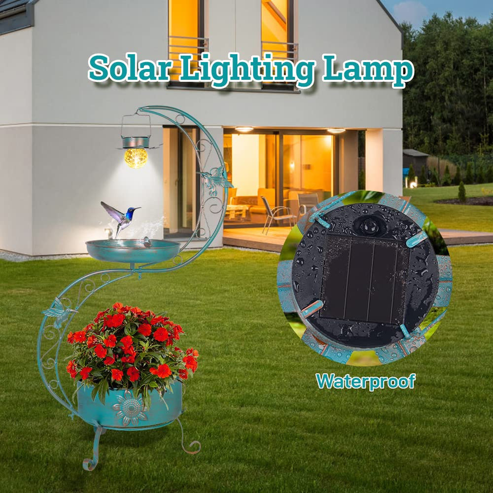DREAMSOUL nighttime glow of birdbath providing soft ambient garden lighting