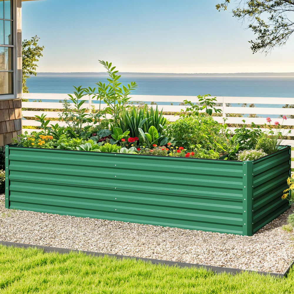 DWVO raised bed beside a person demonstrating scale and planting depth