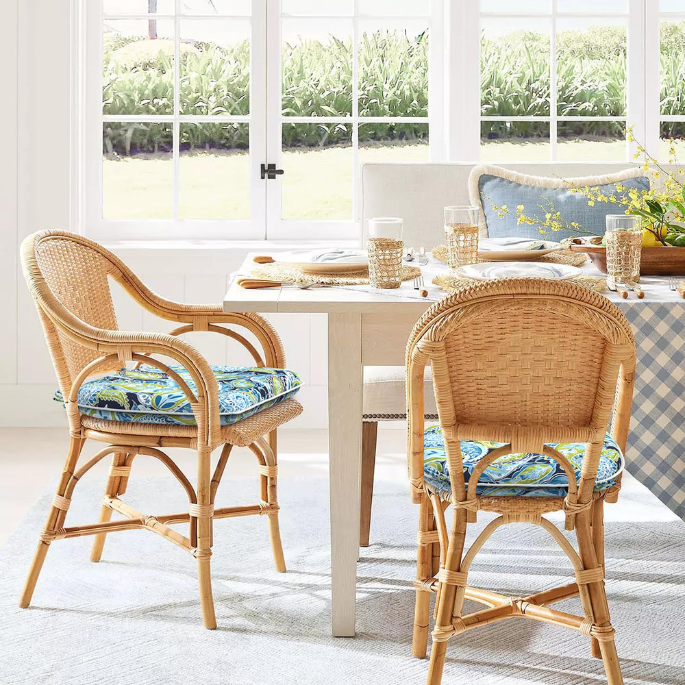 DYTXIII cushions styled on a garden bench among plants for an inviting, coordinated outdoor look