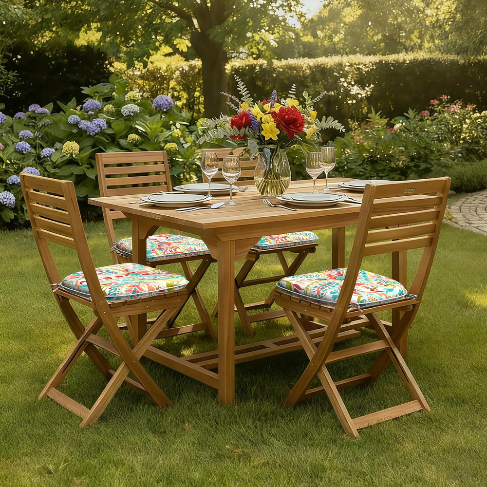 DYTXIII cushions styled on a garden table setting showing colorful outdoor refresh and atmosphere