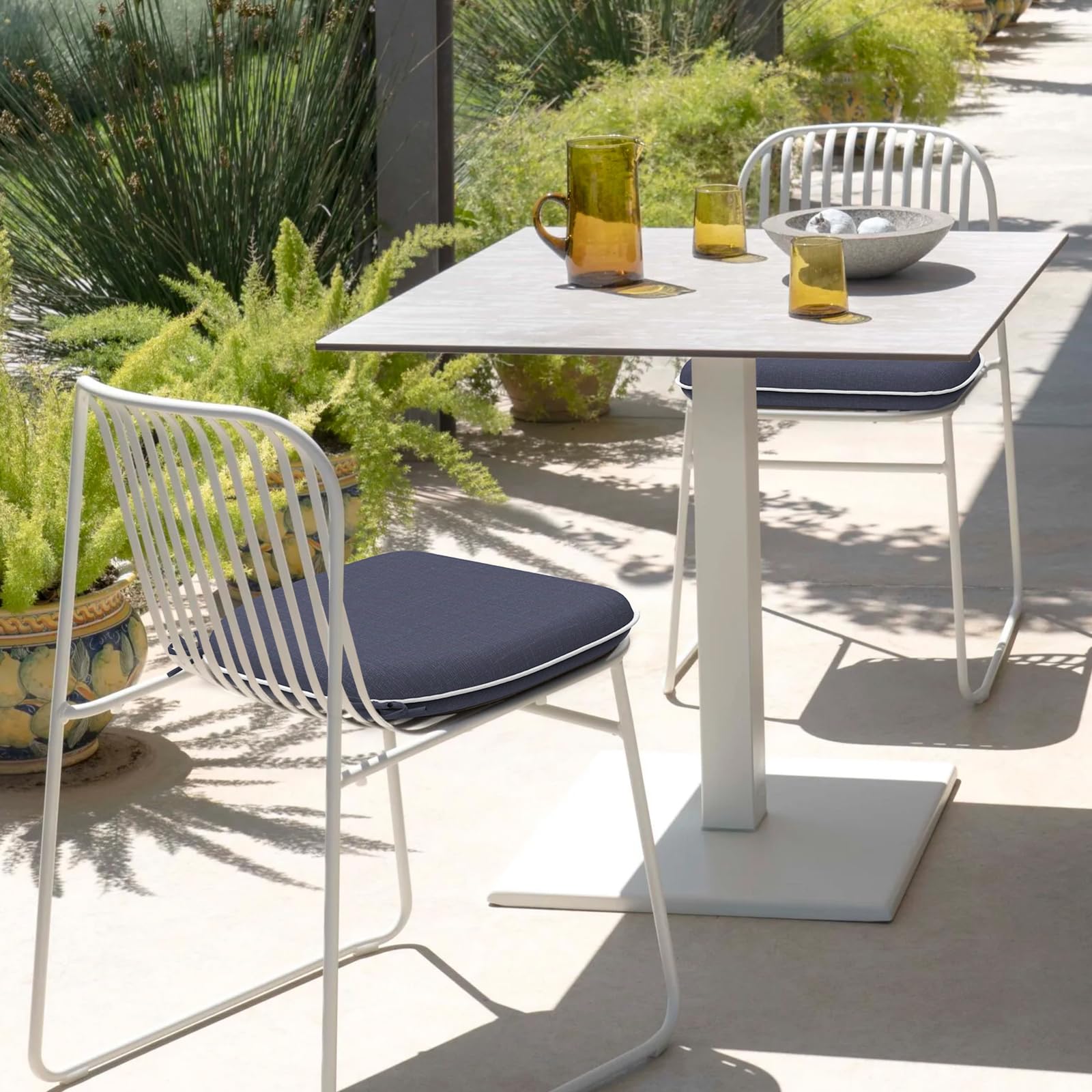 DYTXIII cushion on a patio chair in a sunny backyard illustrating outdoor comfort and style