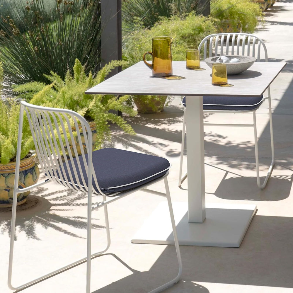 DYTXIII cushion on a patio chair in a sunny backyard illustrating outdoor comfort and style