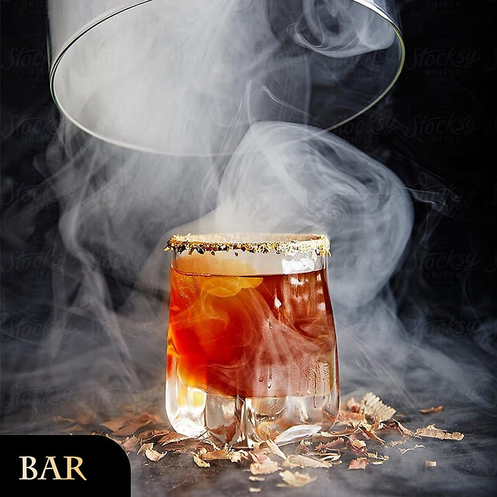 EAEX handheld dispenser in action over a glass, demonstrates easy bar use