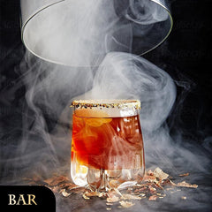 EAEX handheld dispenser in action over a glass, demonstrates easy bar use