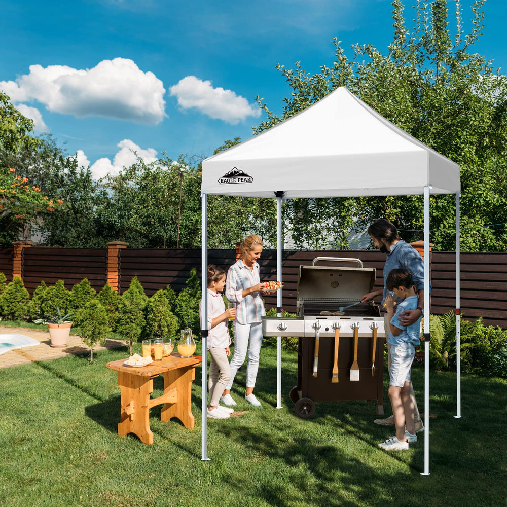 EAGLE PEAK canopy in use at a market providing portable vendor shade