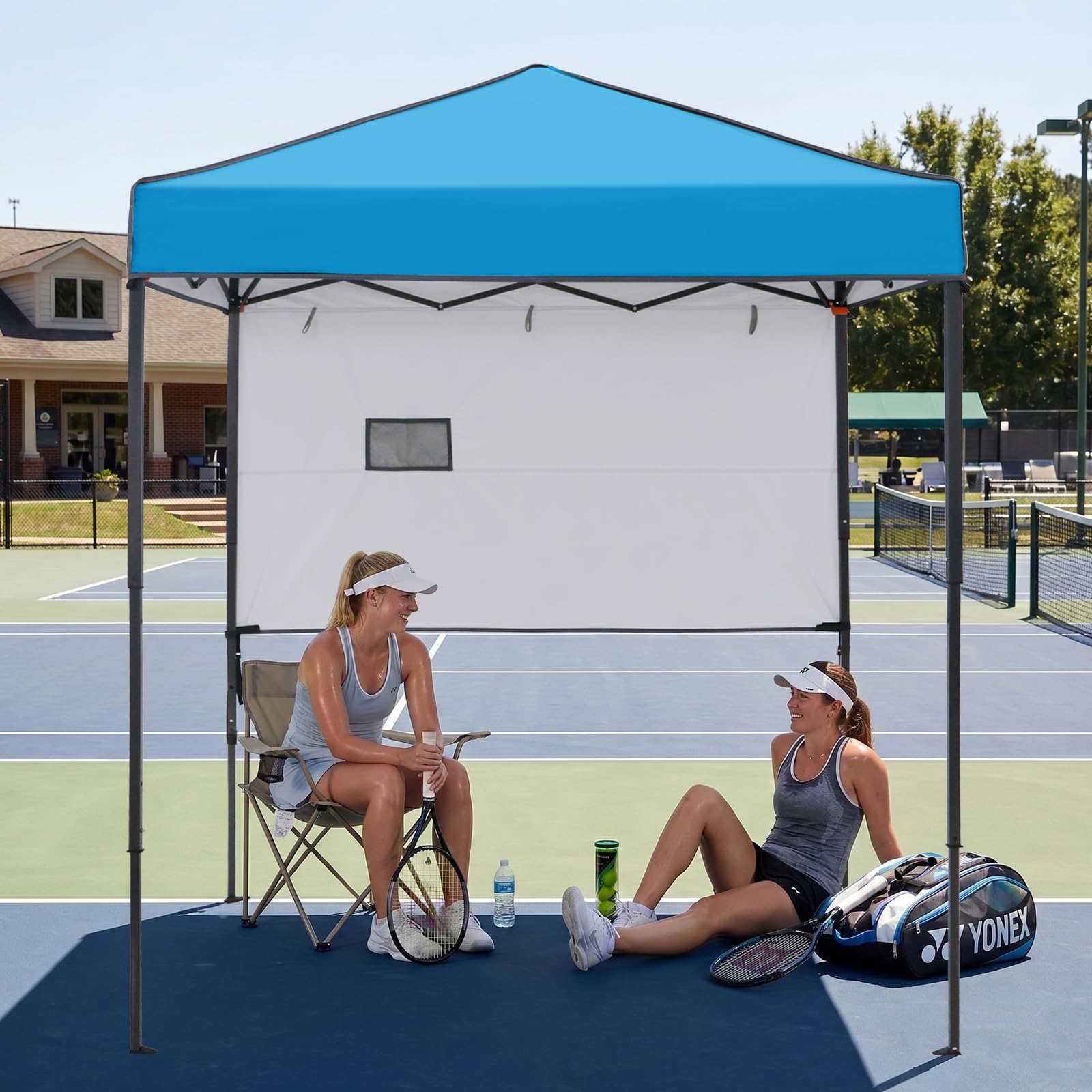 EAGLE PEAK canopy with people showing coverage area and seating benefit