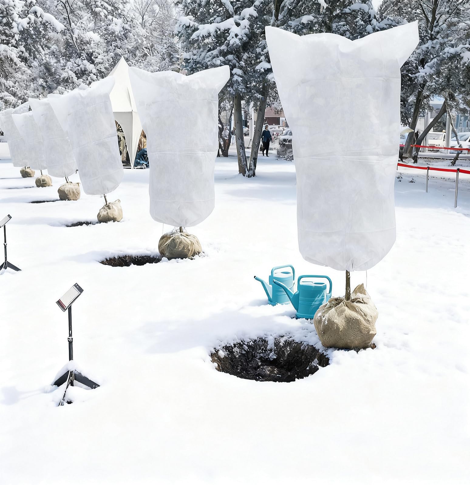 EAONE cover next to gardening tools showing 47x71 inch size for scale and fit