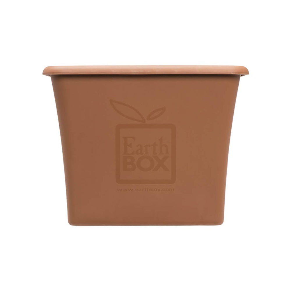 EarthBox next to garden tools showing size and portability with EarthBox easy mobility