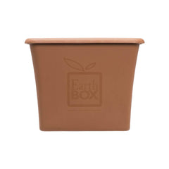 EarthBox next to garden tools showing size and portability with EarthBox easy mobility