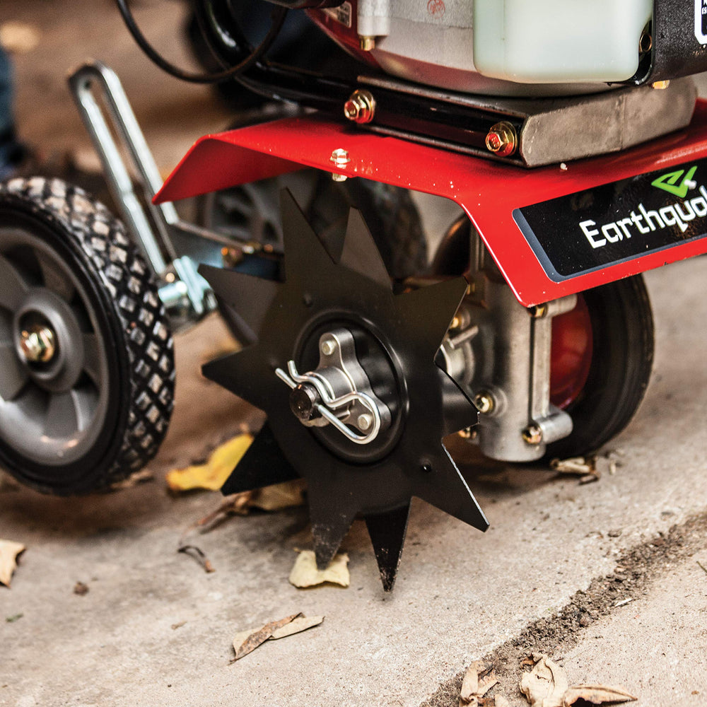 EARTHQUAKE edger in use along sidewalk illustrating crisp, uniform borders