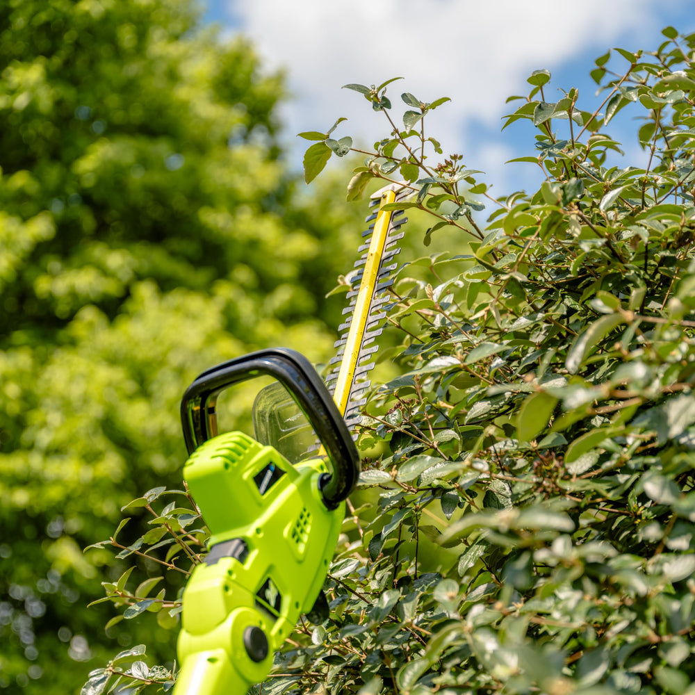 Earthwise pole extension attached to reach high hedges safely