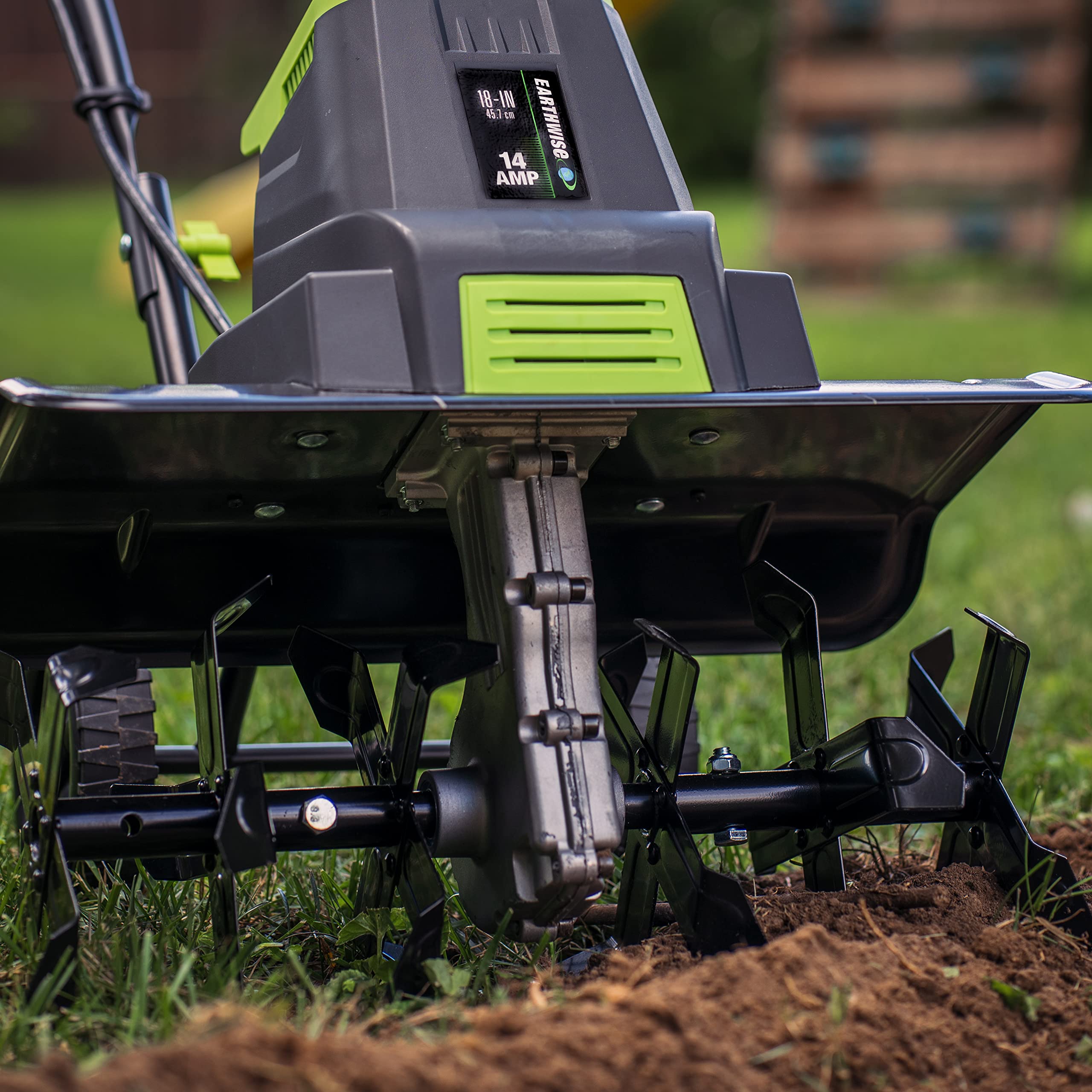 Earthwise tiller in use breaking up soil for faster bed preparation