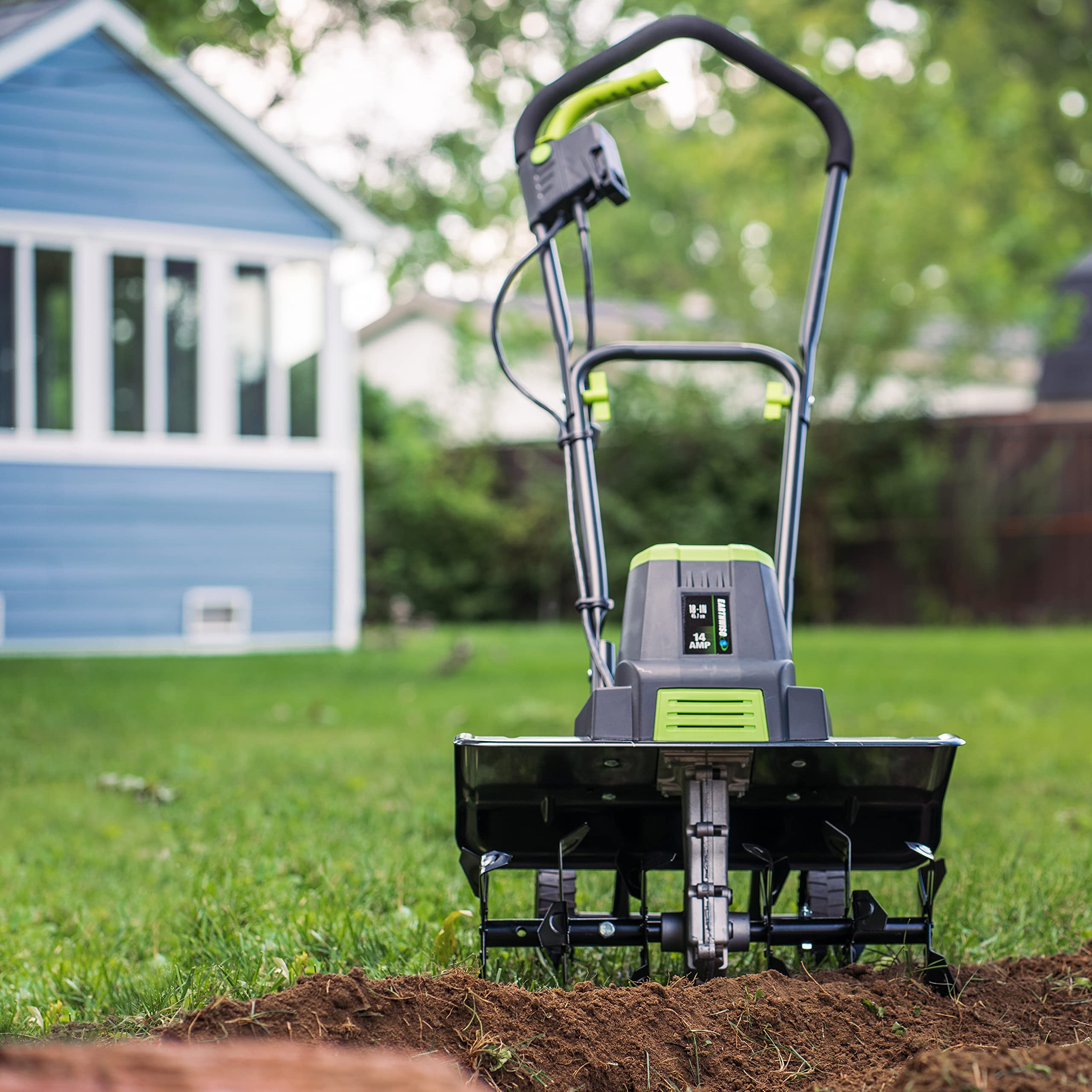 Earthwise side profile in garden showing 18-inch working width advantage