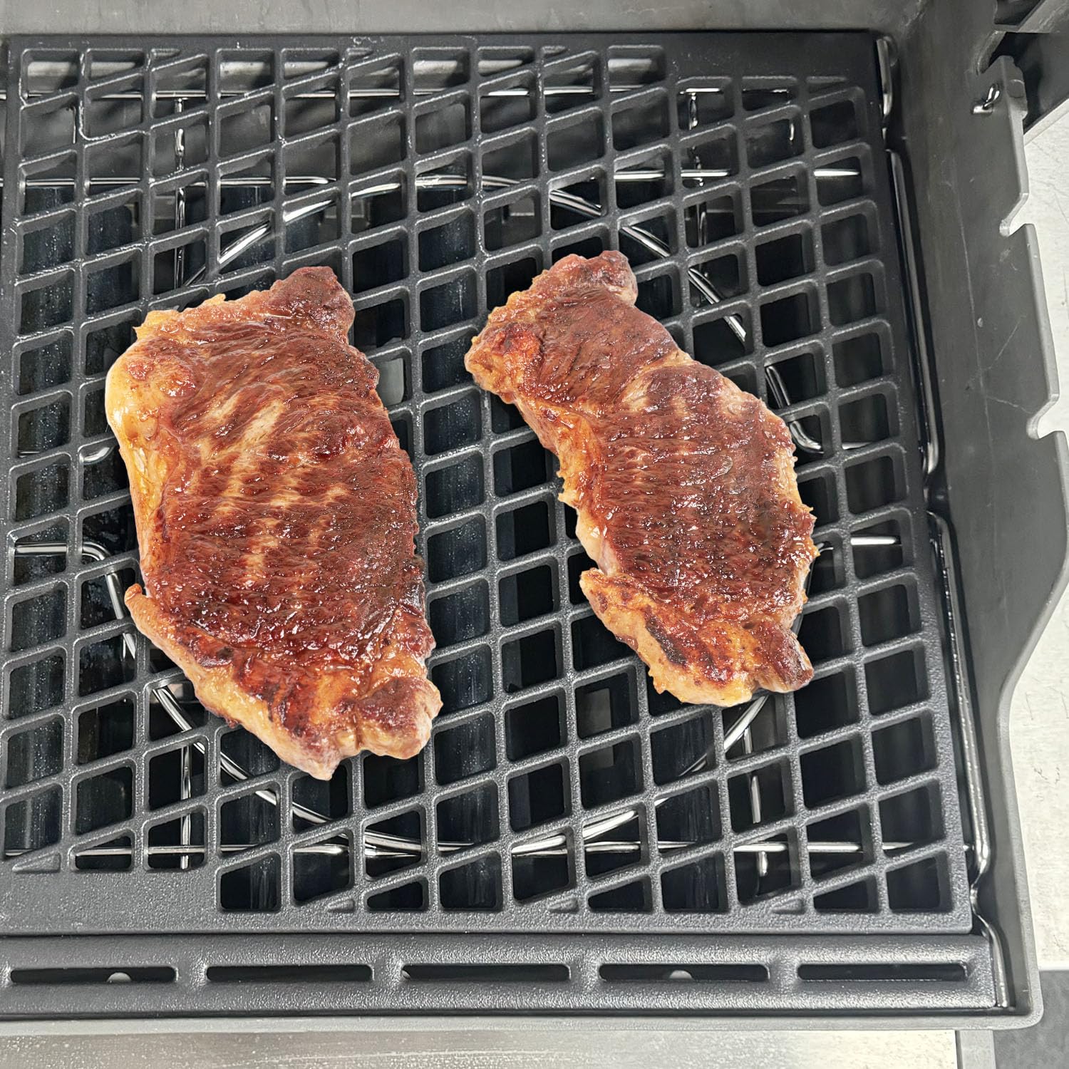 EasiBBQ frame fitted in a grill in backyard setting showing versatile use benefit
