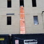 Easy Chute 10ft section beside person for scale and easy handling