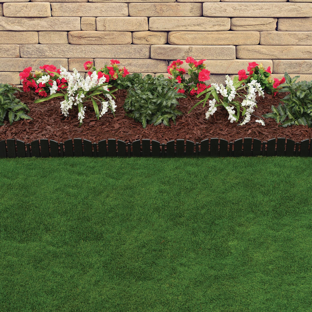 EasyFlex edging framing a flower bed in a yard, providing tidy containment and curb appeal