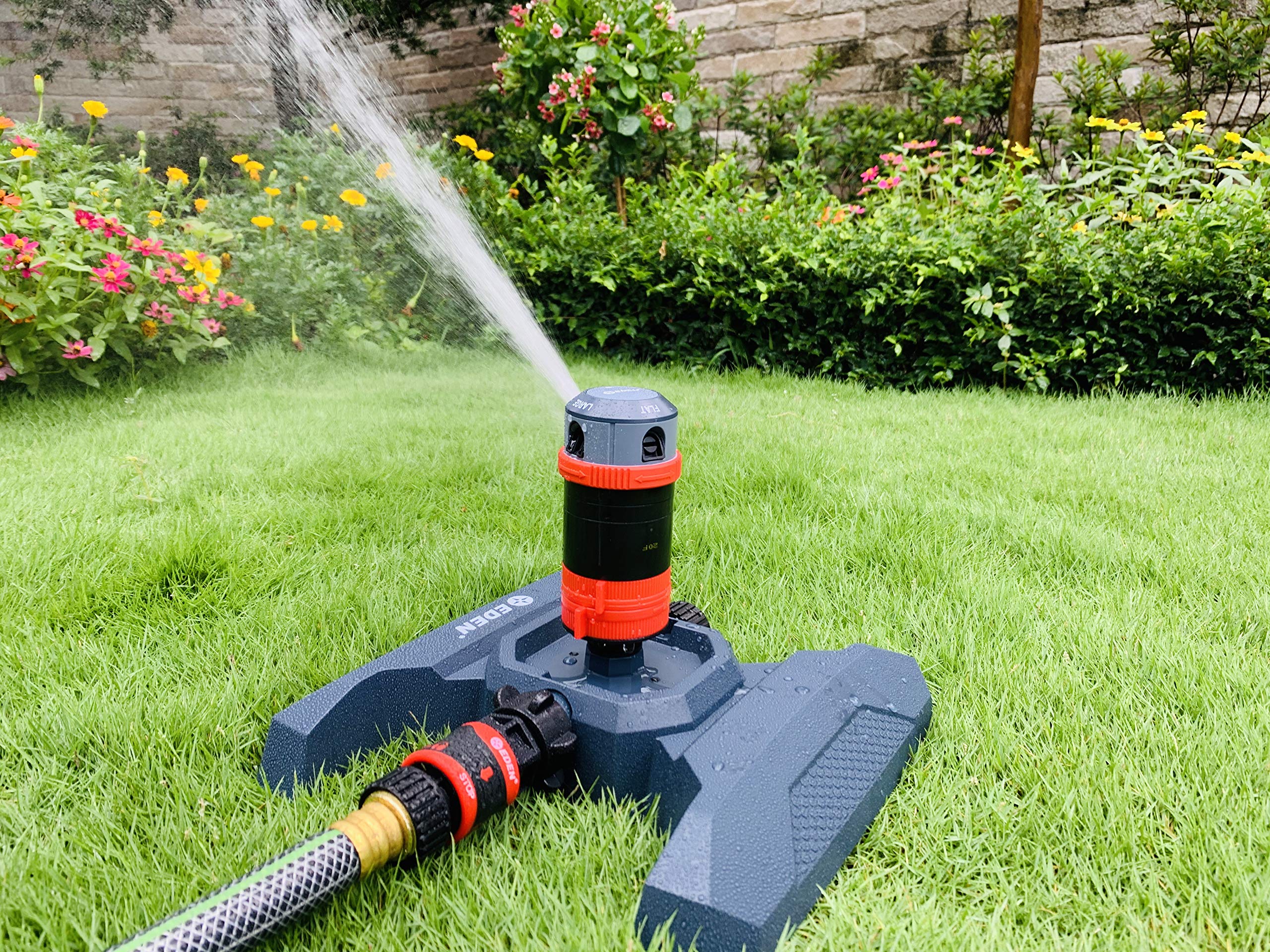 Eden 94123 spraying a yard showing wide 360-degree coverage and quiet operation