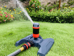 Eden 94123 spraying a yard showing wide 360-degree coverage and quiet operation