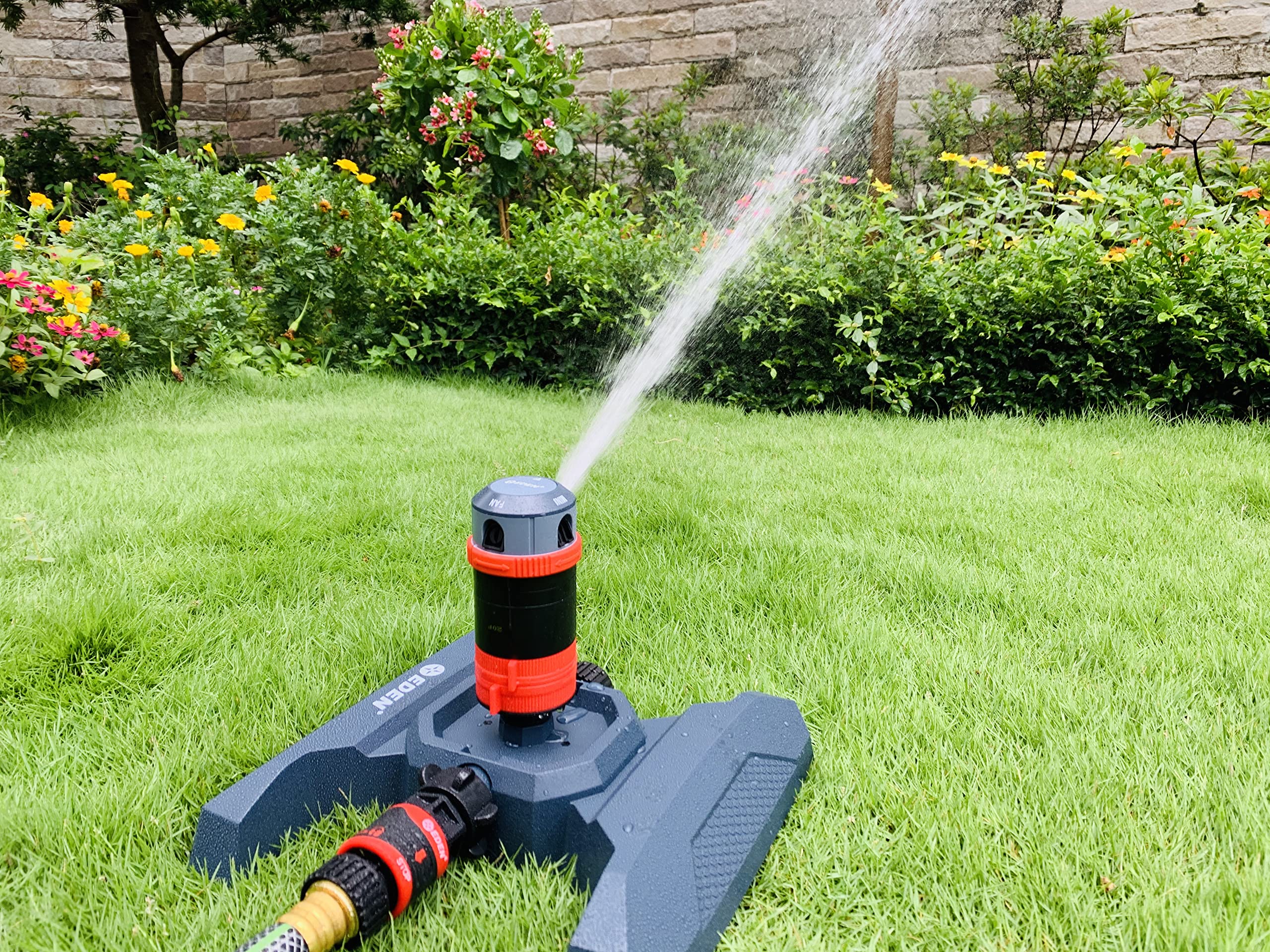 Eden sprinkler in use on lawn showing even coverage benefit