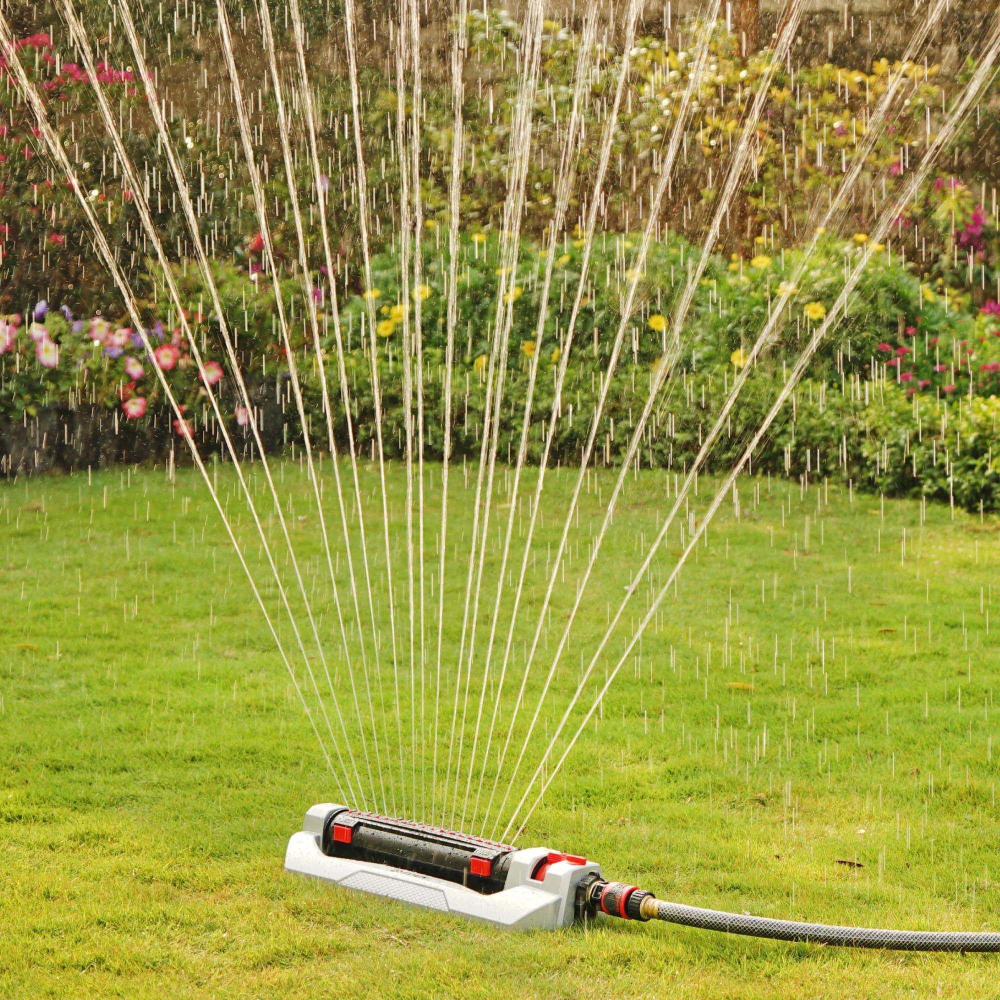 Eden sprinkler in use across lawn showing broad coverage and consistent irrigation