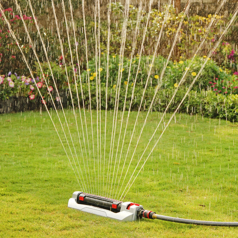 Eden sprinkler in use across lawn showing broad coverage and consistent irrigation