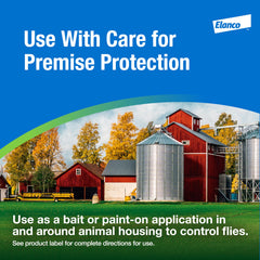 Elanco QuickBayt scattered outside a barn illustrating perimeter fly protection