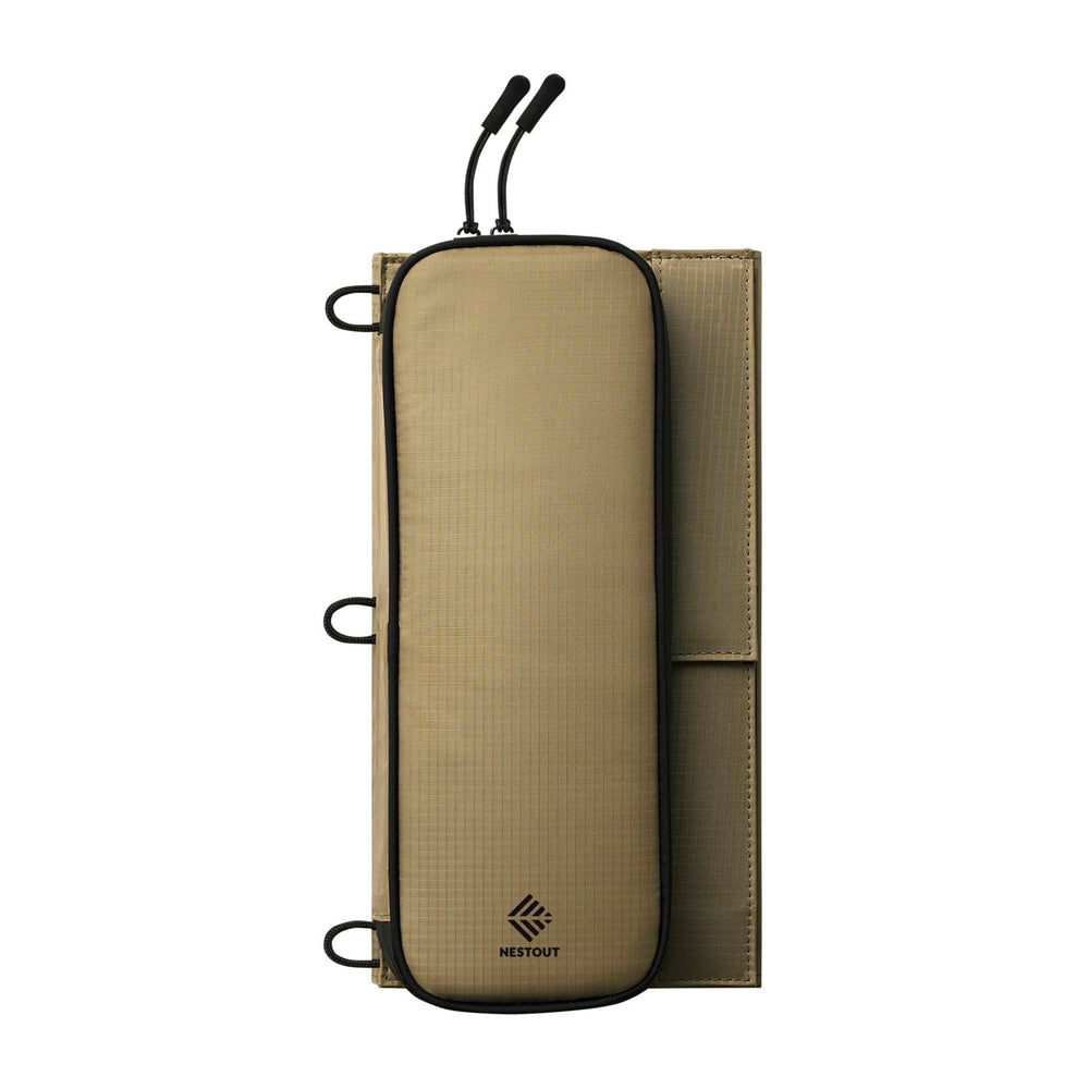 ELECOM NESTOUT in a campsite setting charging a phone under daylight conditions