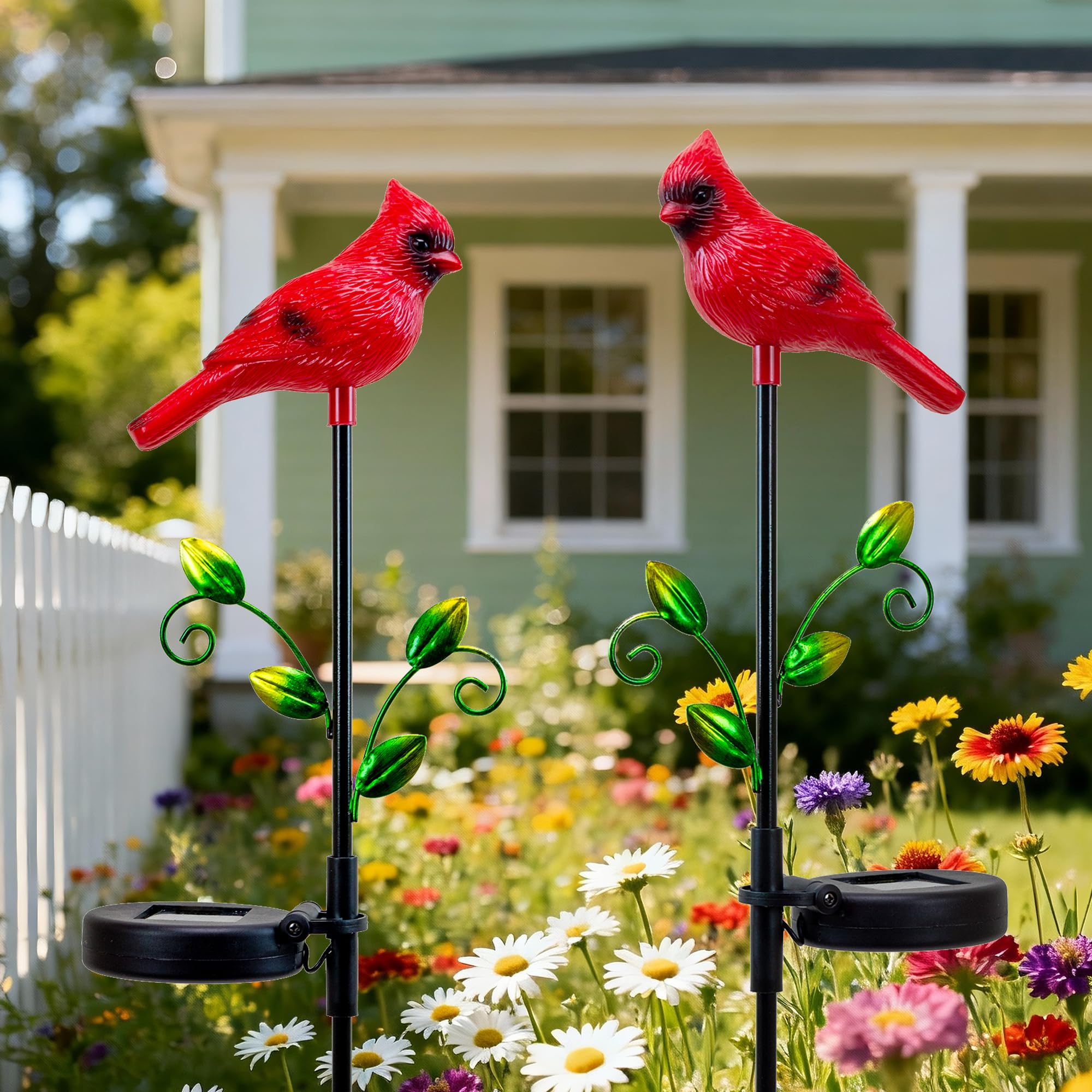 Elfengarden cardinal lit at night casting soft solar glow for pathway safety