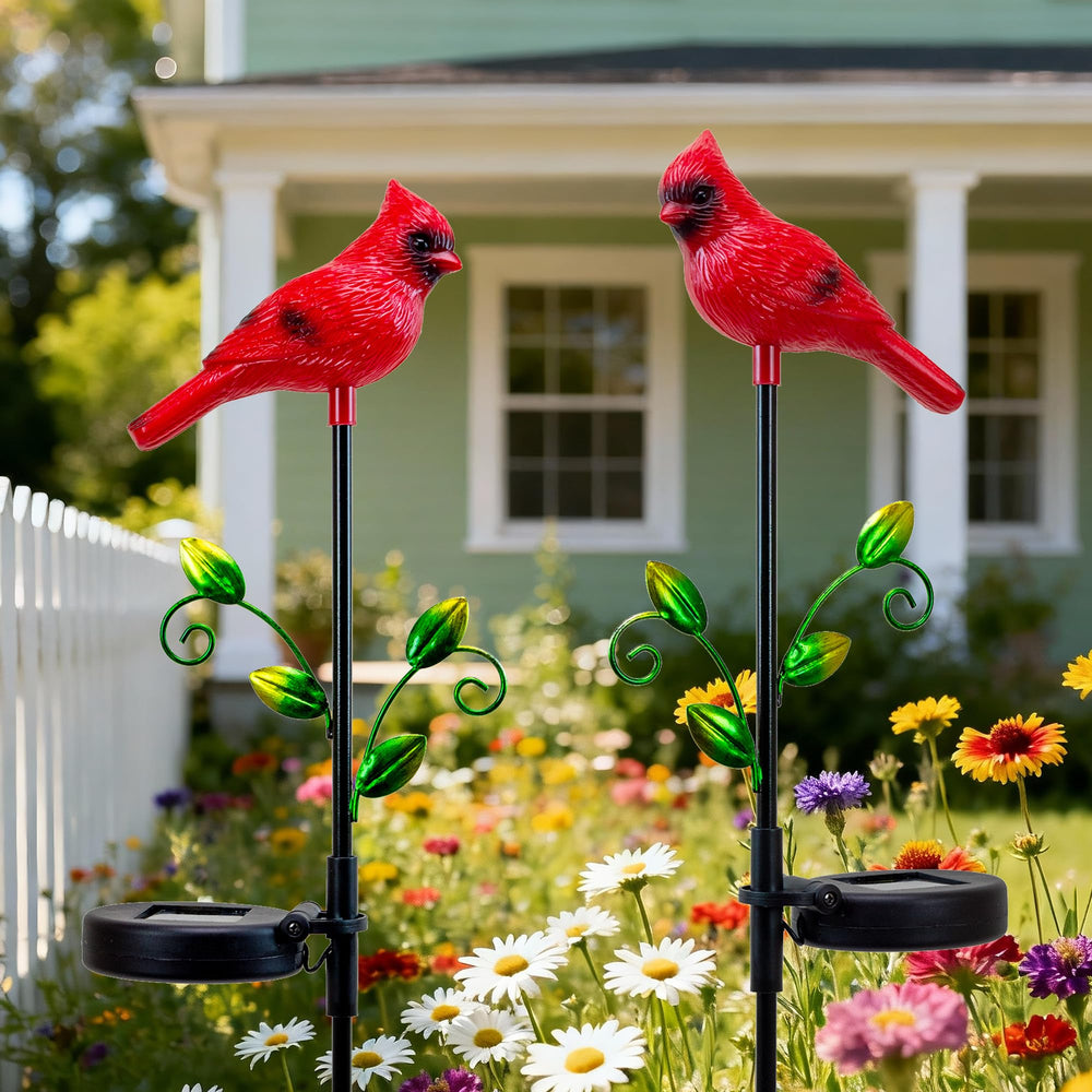 Elfengarden cardinal lit at night casting soft solar glow for pathway safety