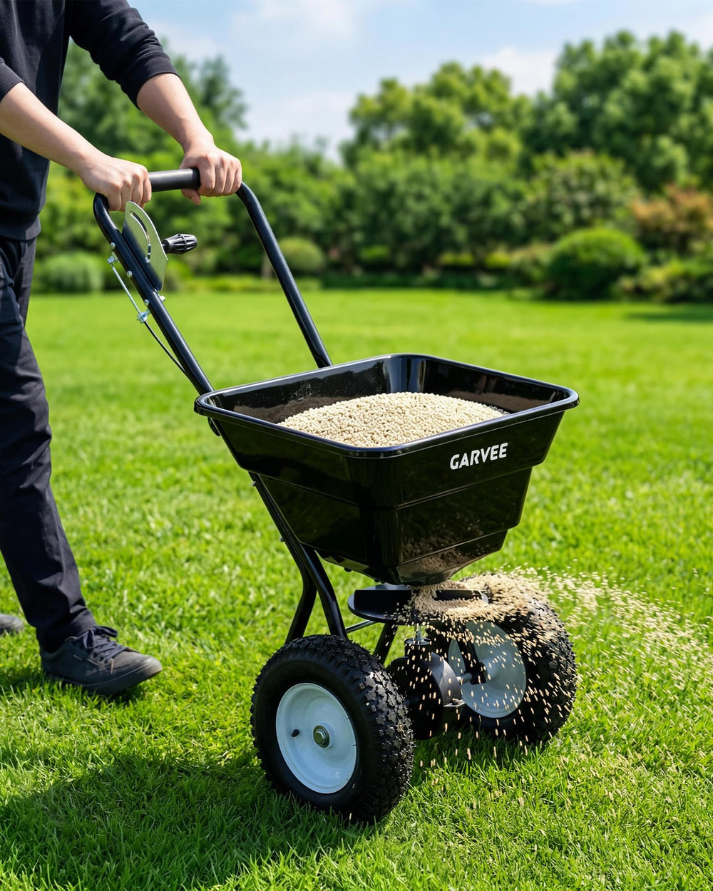 EliteEdge spreading fertilizer on a lawn for faster, even coverage