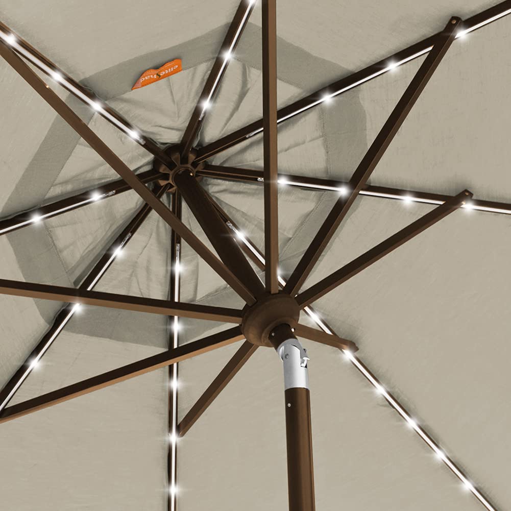 EliteShade installed in backyard patio at dusk demonstrating lighting and outdoor comfort
