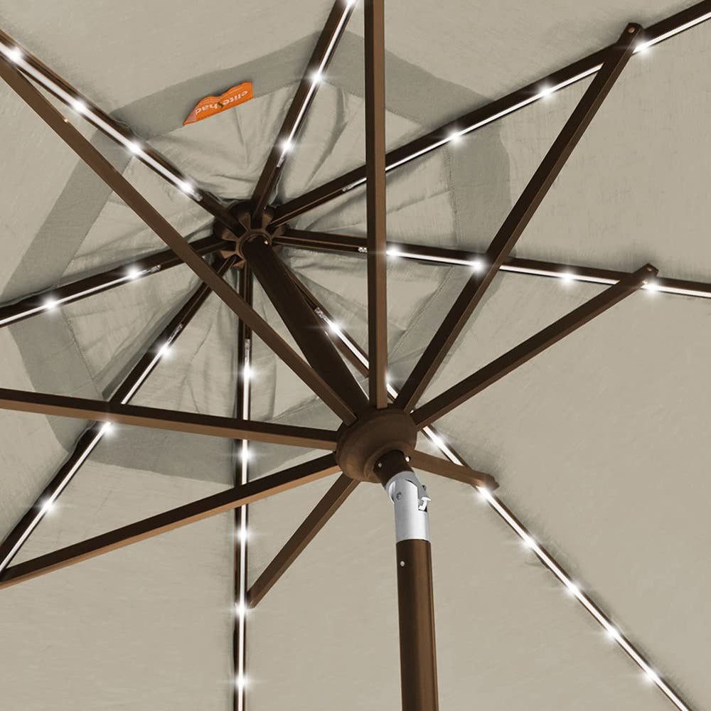 EliteShade installed in backyard patio at dusk demonstrating lighting and outdoor comfort