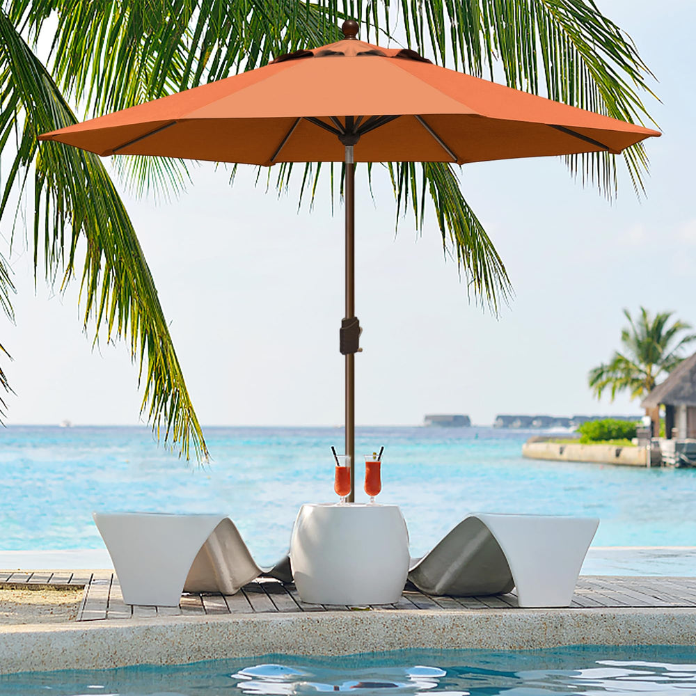 EliteShade umbrella beside table showing size and scale for furniture fit
